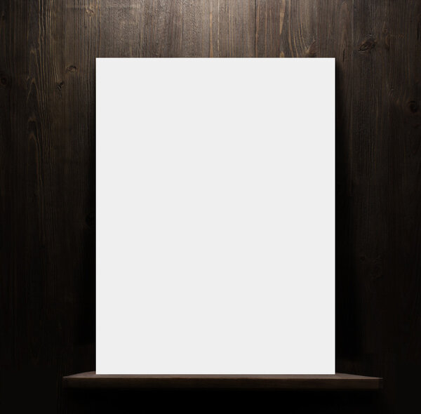 Wooden shelf with blank poster