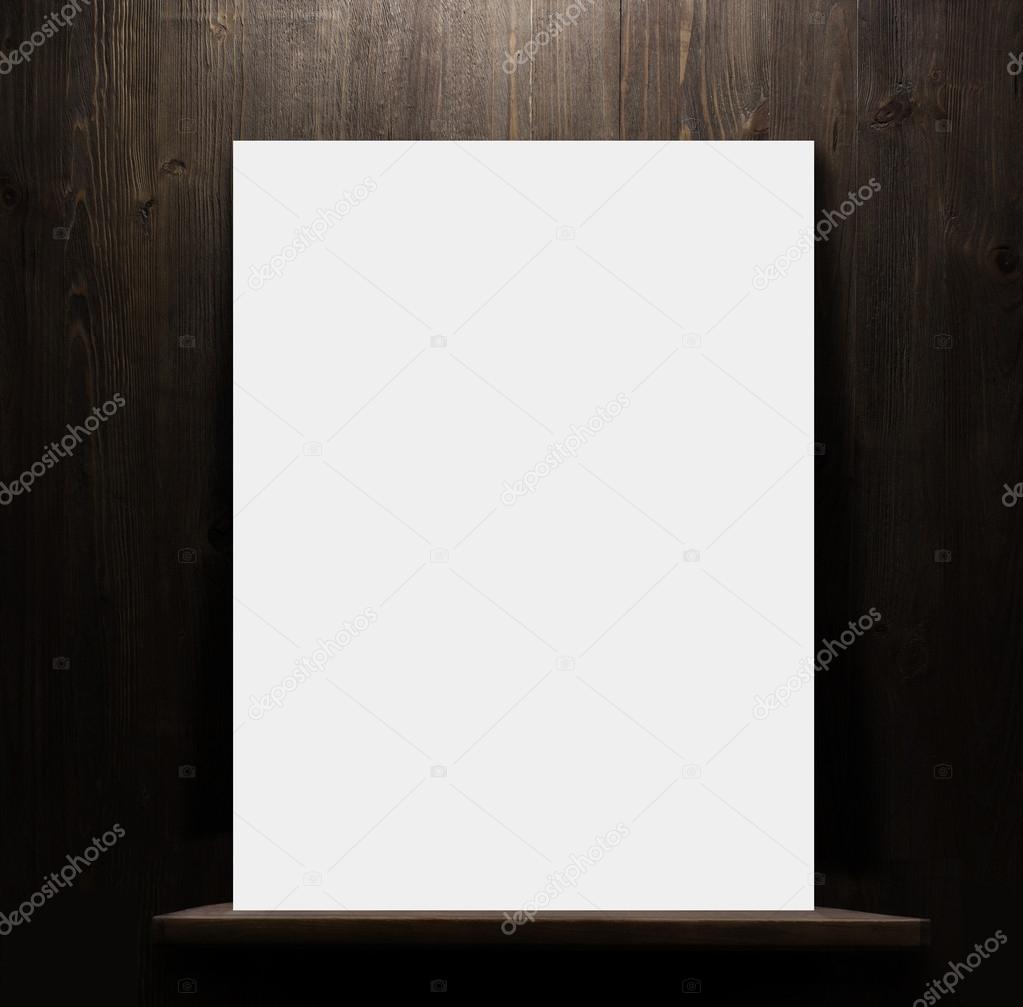 Wooden shelf with blank poster