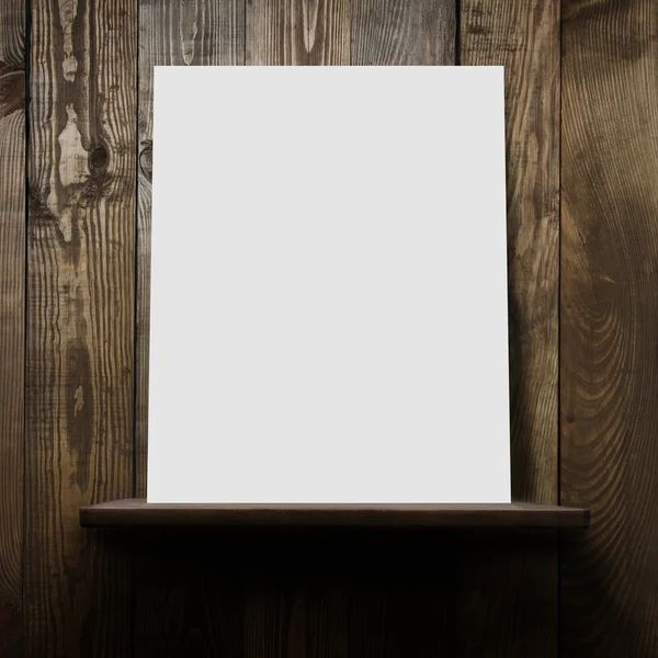 Wall with shelf and blank poster — Stock Photo, Image