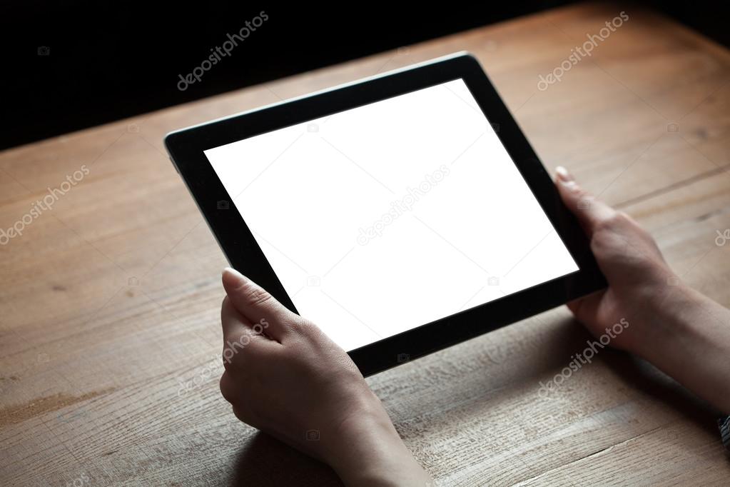 Female hands holding tablet computer