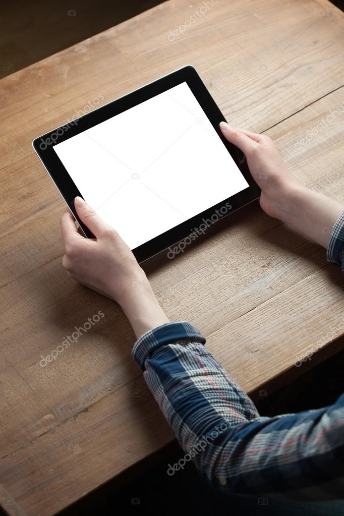 Female hands holding digital tablet