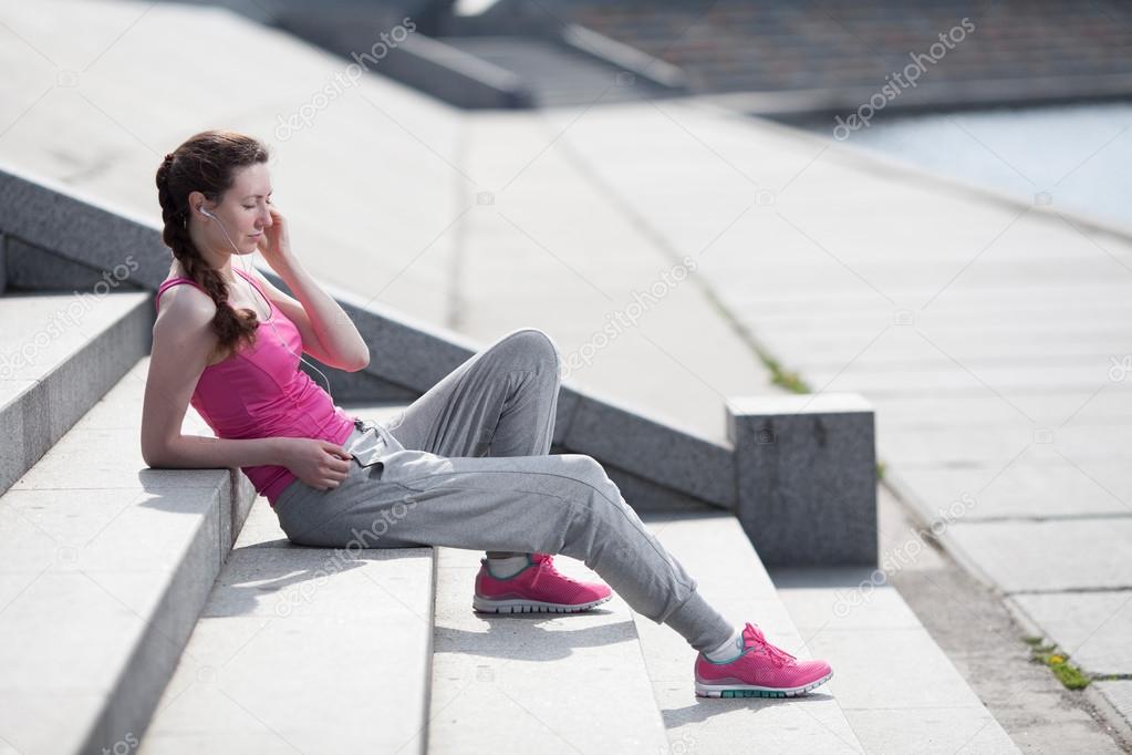 Woman listening to mp3 player