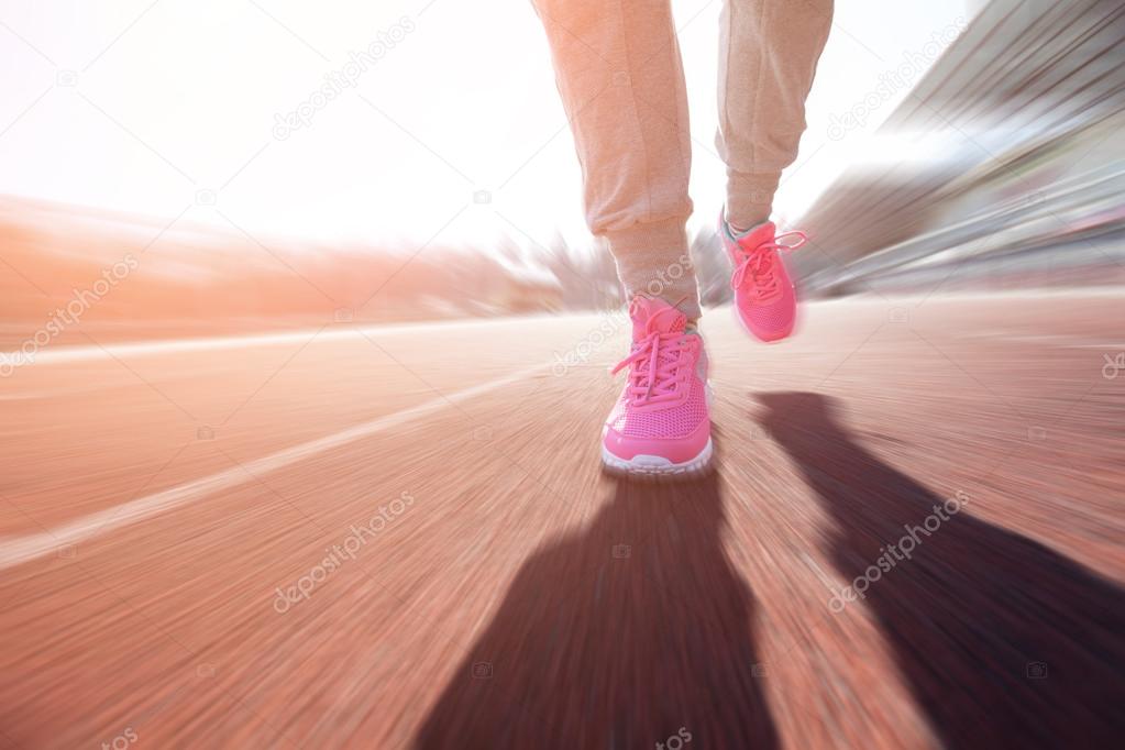 Woman running on a track