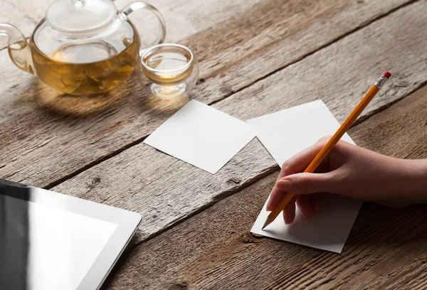 Girl writing on a sheet of paper — Stock Photo, Image