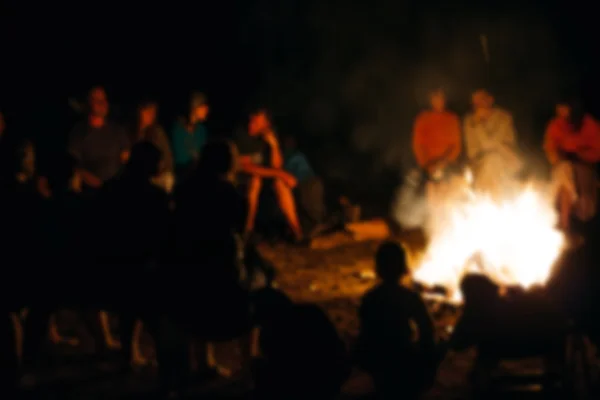 depositphotos_78526108-stock-photo-people-sit-at-night-round.jpg