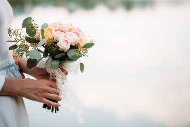 wedding bouquet of flowers in hands clipart