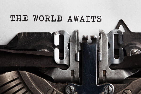 World awaits sign written by typewriter