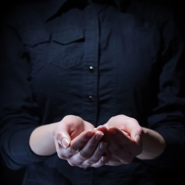 Womans cupped hands holding something — Stock Photo, Image