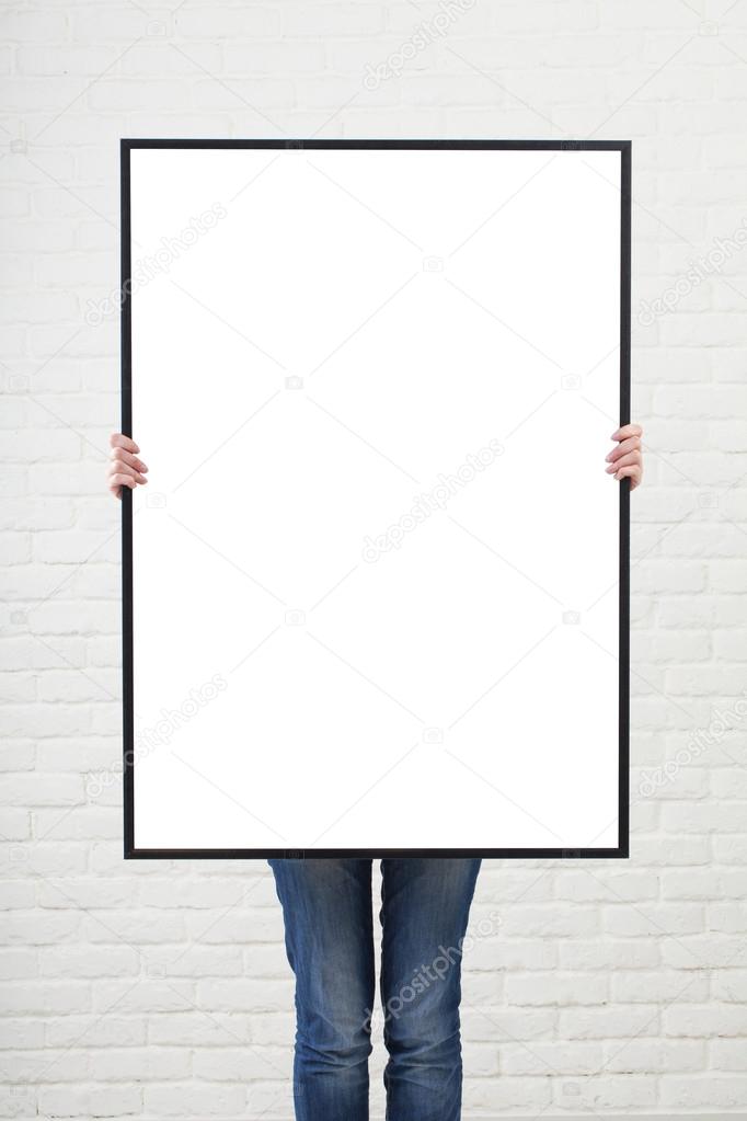woman with  blank poster on wall background