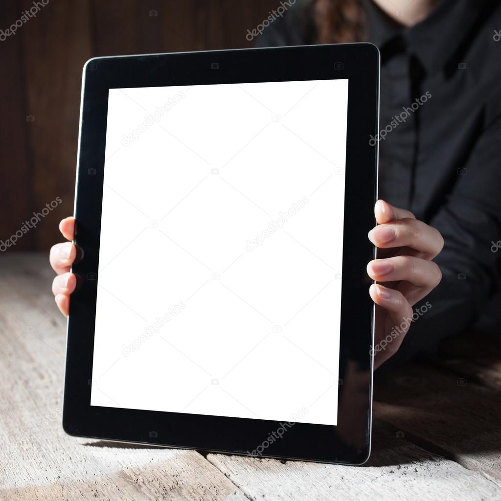 hands hold the tablet