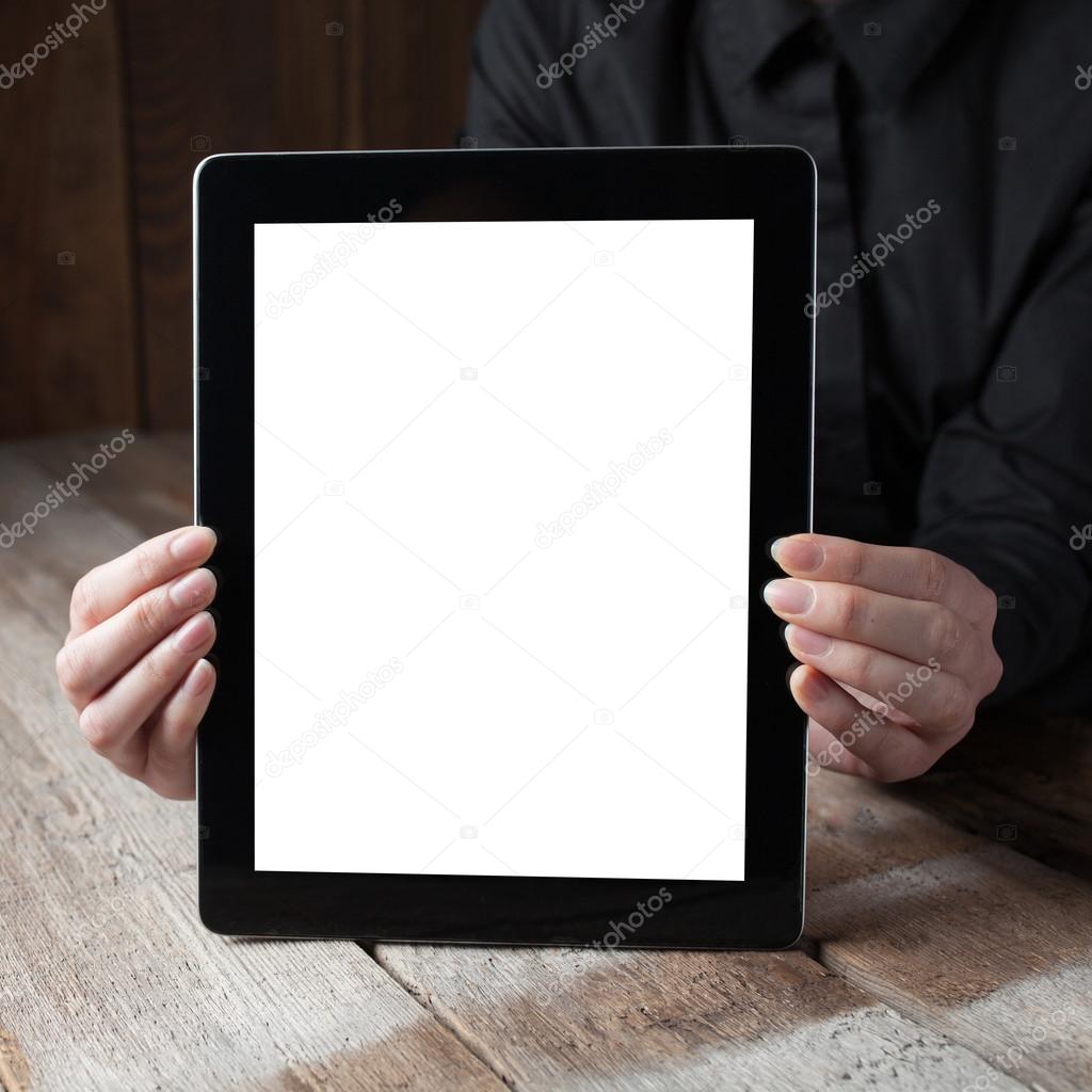 hands hold the tablet