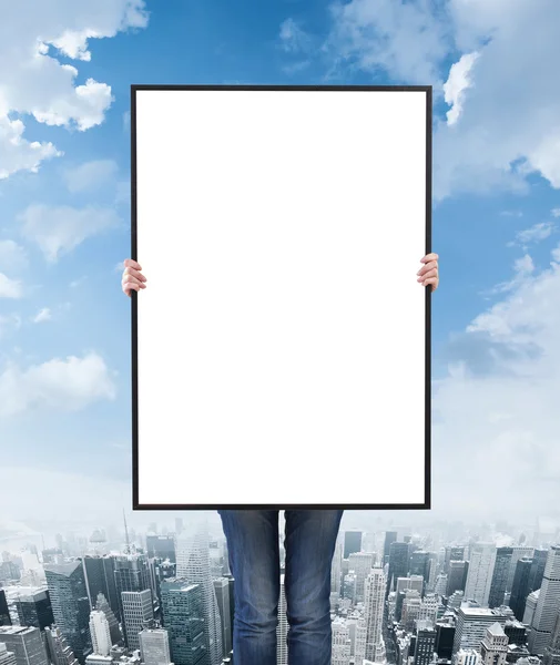 Woman holding a blank poster — Stock Photo, Image