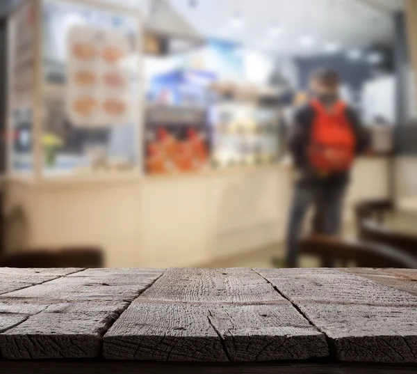 Café verschwommener Hintergrund mit Bokeh und Holzboden — Stockfoto
