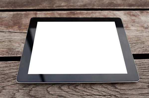 Tablet pc computer gadget with isolated screen on a wooden backg — Stock Photo, Image