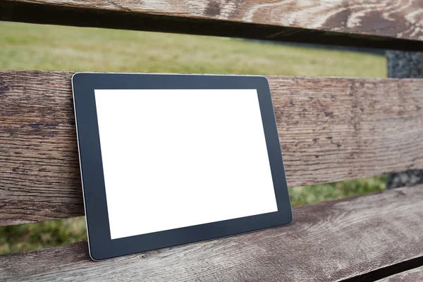 Tablet pc computer gadget with isolated screen on a wooden backg — Stock Photo, Image