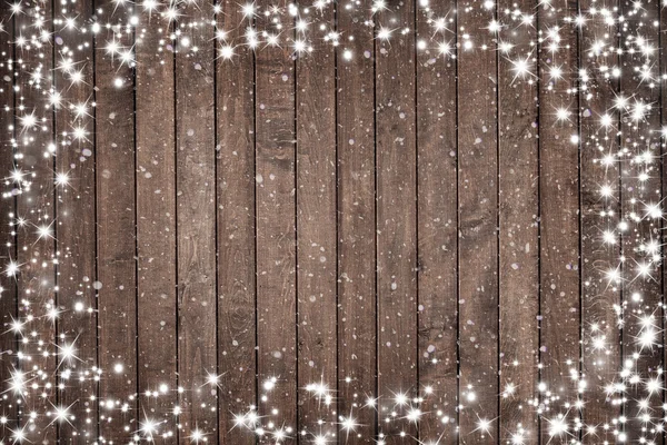 Ξύλινο υπόβαθρο με νιφάδες χιονιού. Χριστούγεννα φόντο — Φωτογραφία Αρχείου