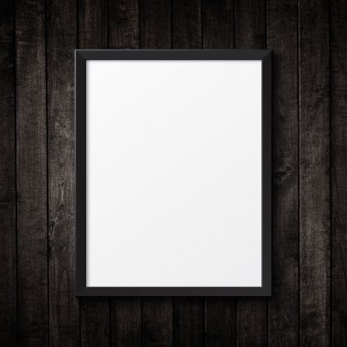 Ahşap doku üzerine boş siyah resim çerçevesi. arka plan
