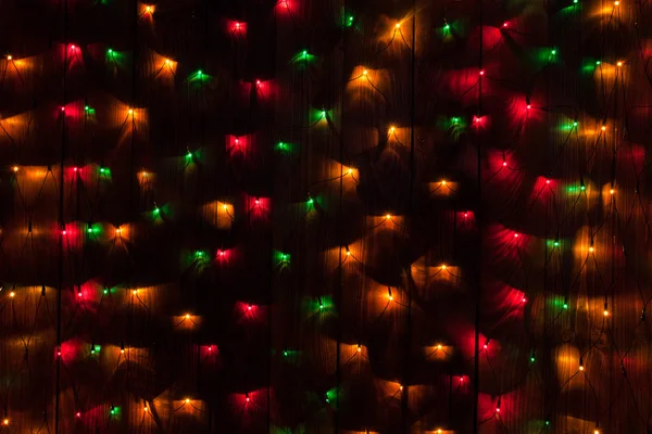 Kerstmis achtergrond. ld hout met verlichting — Stockfoto