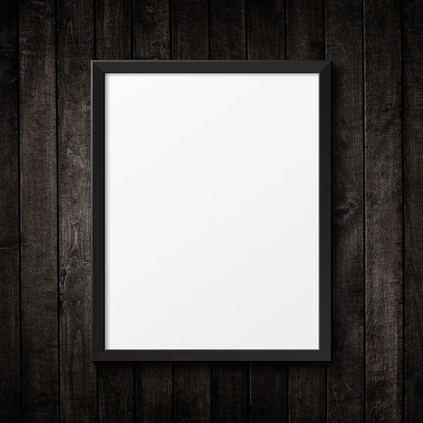 Blank black picture frame on the grunge wood texture. background — Stock Photo, Image