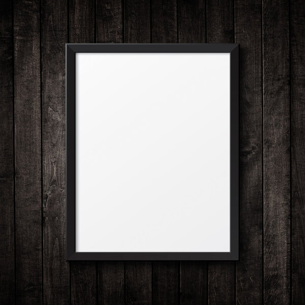 Blank black picture frame on the grunge wood texture. background old panels