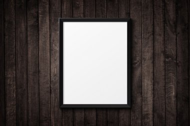 Ahşap doku üzerine boş siyah resim çerçevesi. arka plan