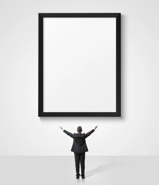 Businessman looking up at empty sign — Stock Photo, Image