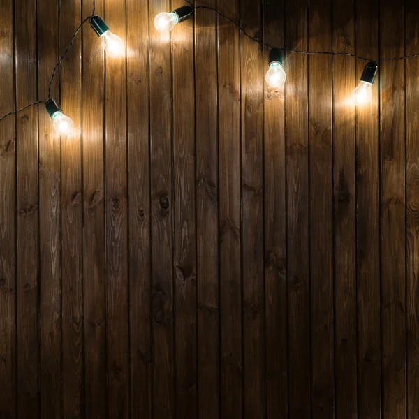Lampadine su sfondo di legno scuro immagine reale — Foto Stock