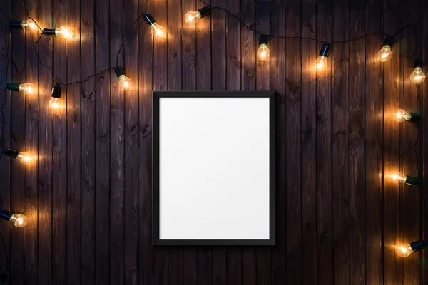 Lampen op donkere houten achtergrond met een poster — Stockfoto