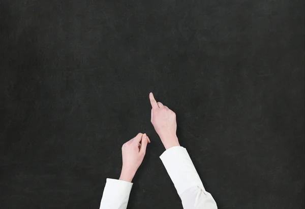 Hand showing something on blackboard — Stock Photo, Image