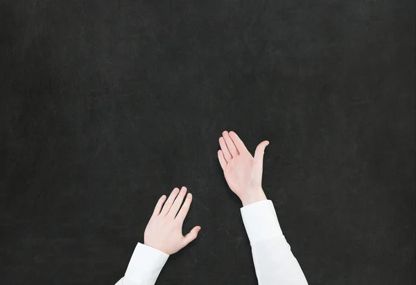 Hand pointing or showing something on blackboard — Stock Photo, Image