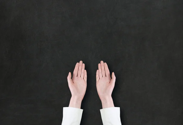 Hand pointing or showing something on blackboard — Stock Photo, Image