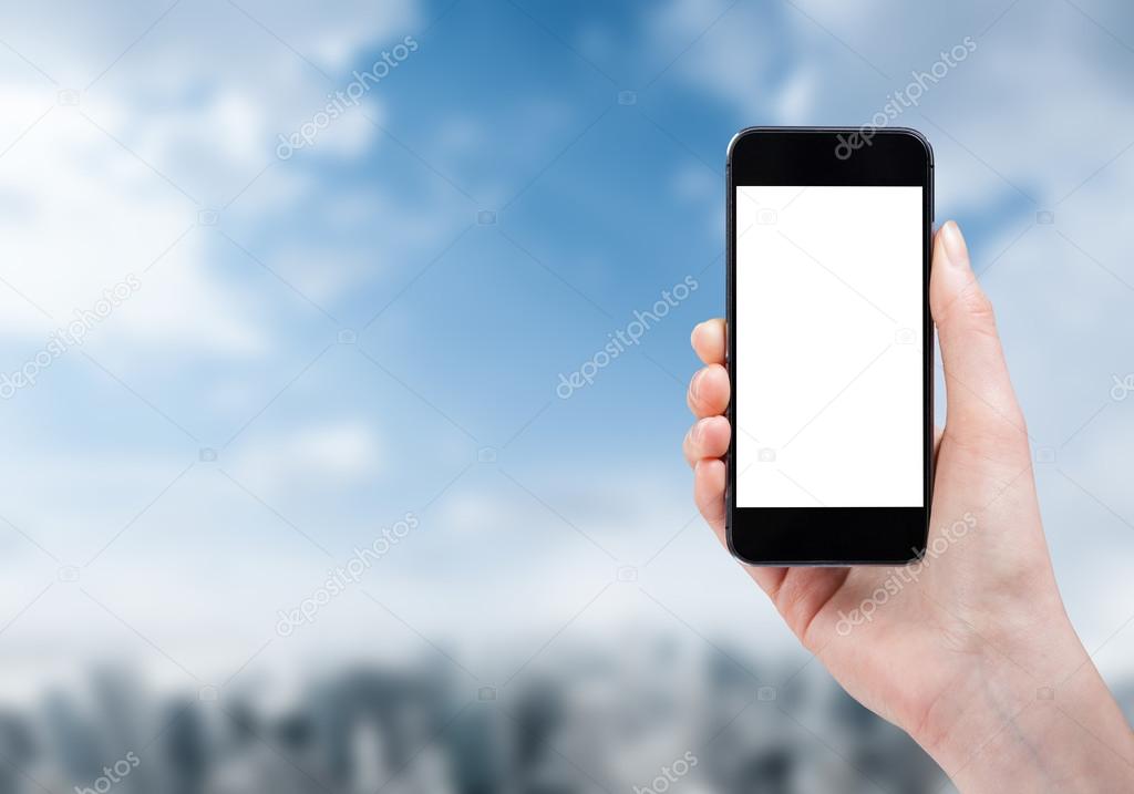 woman hand holding a phone on a city background with isolated sc