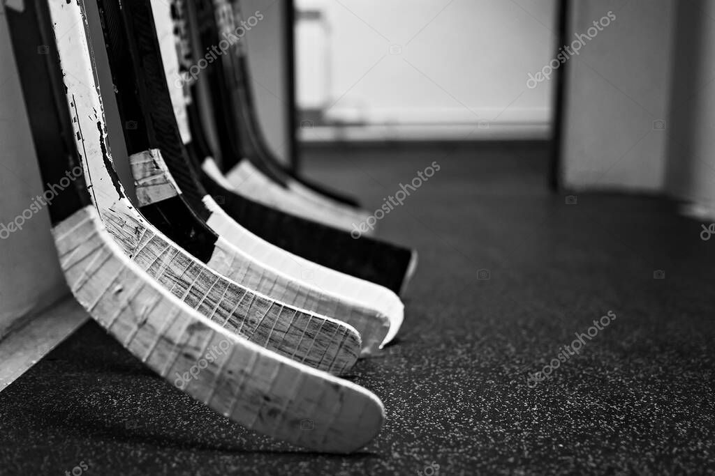Hockey sticks in the locker room hallway before the game