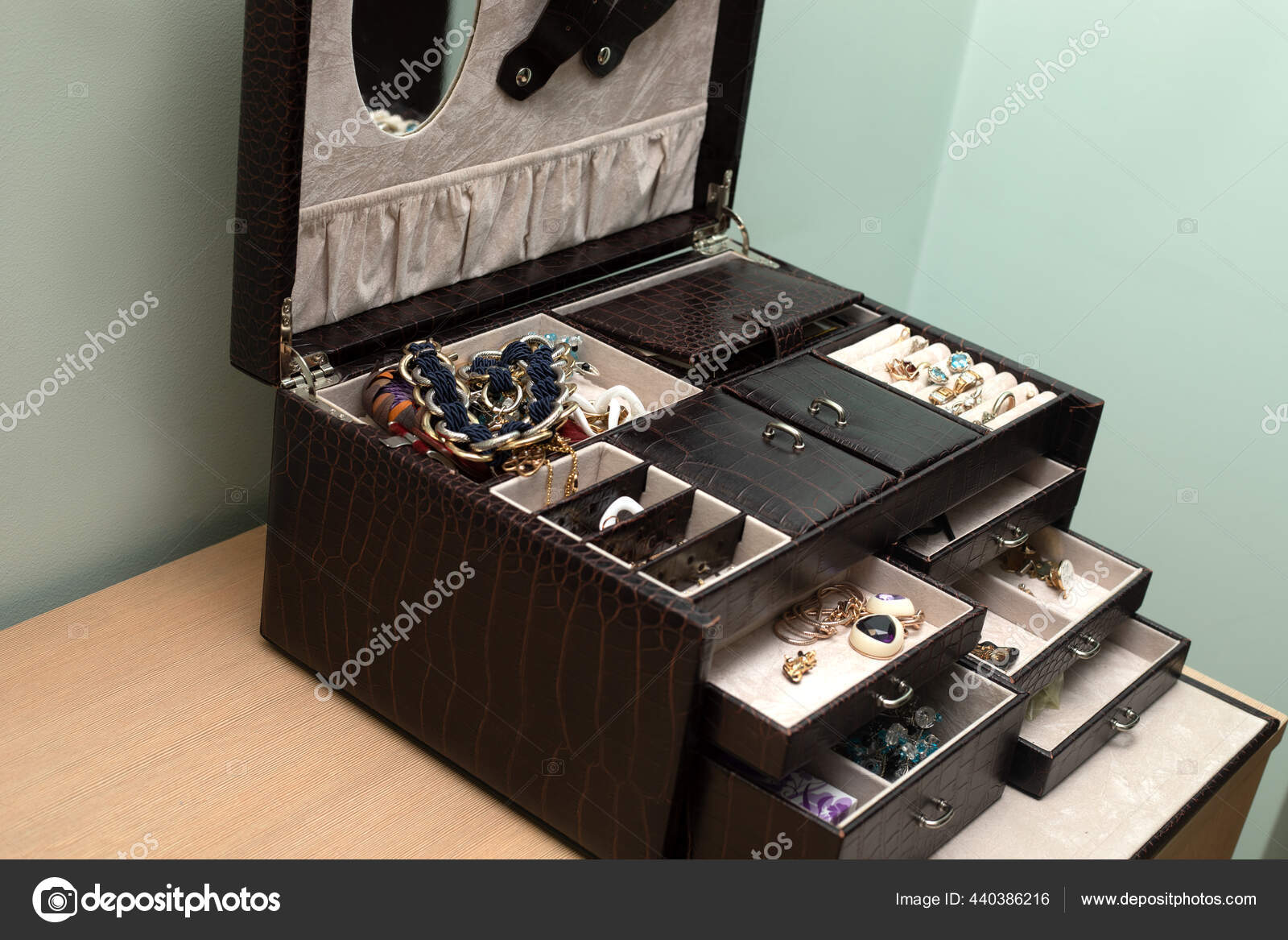Box for storing jewelry made of cracodile skin in interior of room