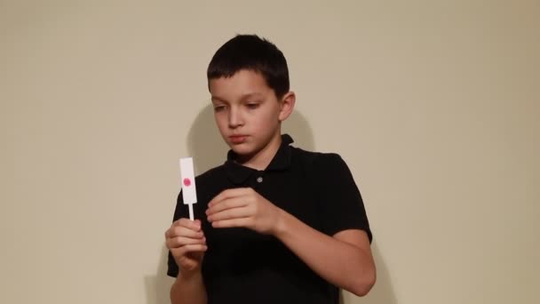 Video of Boy teenager shows trick with red point. Hobbies for children, adolescents — Stock Video