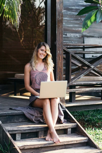 Beautiful Young Woman Communicates Internet Sitting Steps Ofwooden Bungalow Tropics — Stock Photo, Image