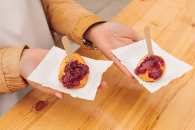 Grilled barbecue cheese on paper plates promises wonderful snack in city cafe. National cuisine. Rest and travel. Taste and pleasure. Natural food. Recipes and traditions. 