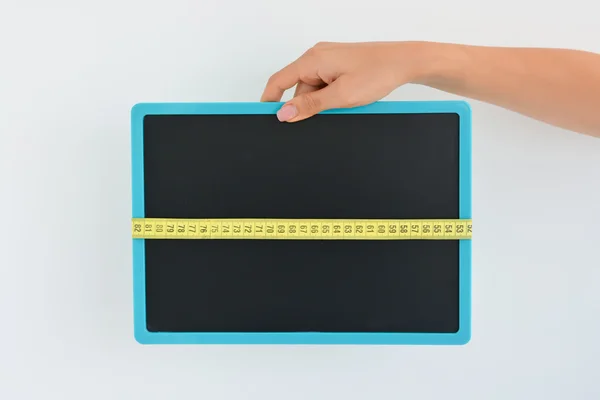 Blackboard with tape measure — Stock Photo, Image