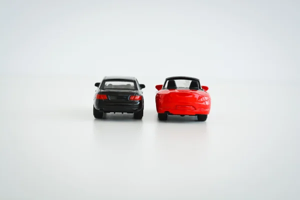 Carros de brinquedo vermelho e preto — Fotografia de Stock