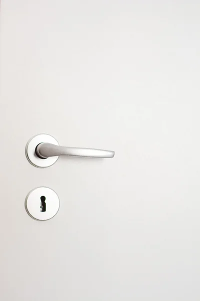 Door handle and lock on white door — Stock Photo, Image