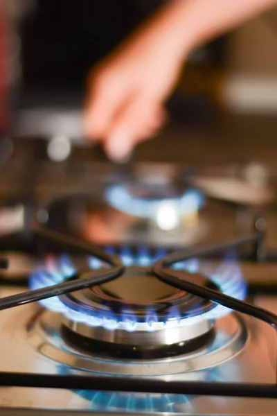 Hand over gas hobs — Stock Photo, Image