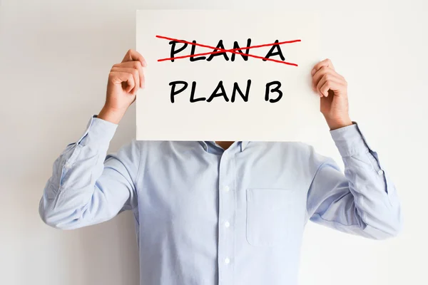 Man holding a carton board with text — Stock Photo, Image