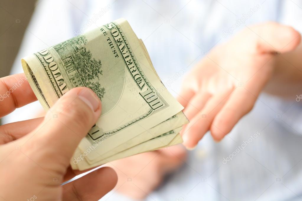 human hands exchanging money