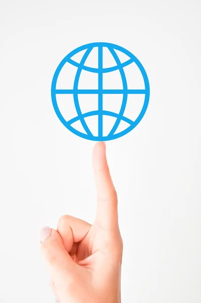 Globe teken op vinger — Stockfoto