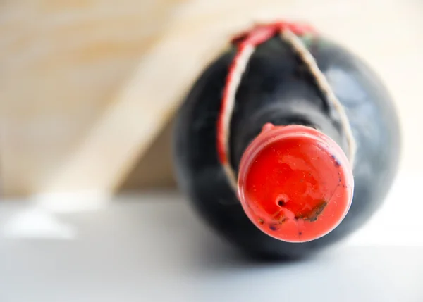 Aged red wine bottle — Stock Photo, Image