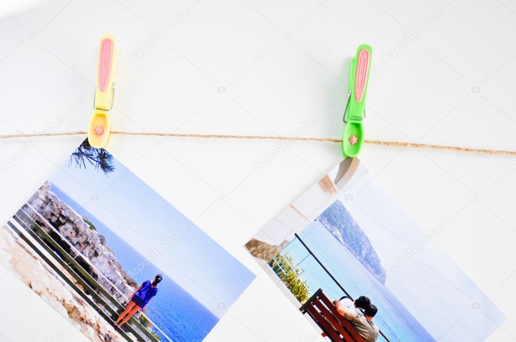 Travel photos hanging with clothespins
