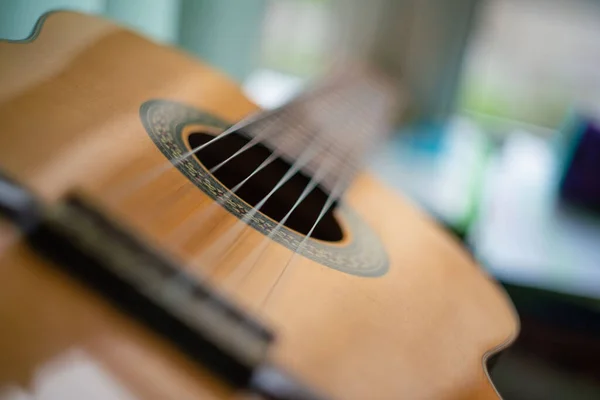 classic spanish guitar on wooden background. guitar with nylon strings