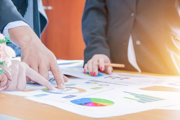 Business Team Corporate Organization Meeting Concept,Business people showing team work while working in board room in office interior. People helping one of their colleague to finish new business plan. Business concept. Team work.