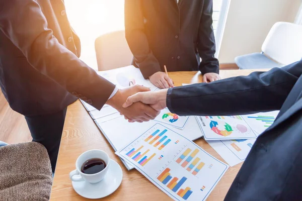 Business Team Corporate Organization Meeting Concept,Business people showing team work while working in board room in office interior. People helping one of their colleague to finish new business plan. Business concept. Team work.