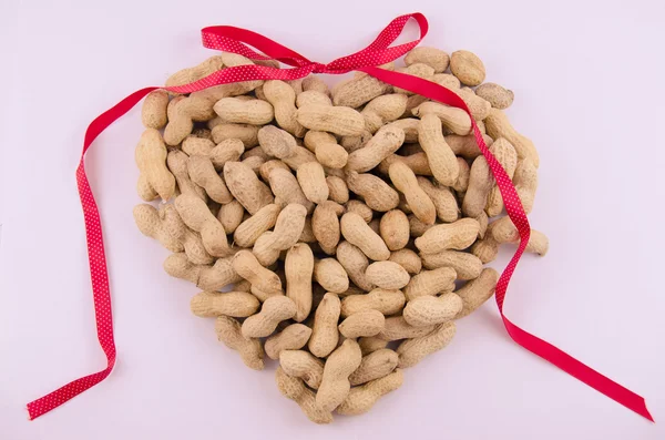Groundnuts in shape of heart Royalty Free Stock Images